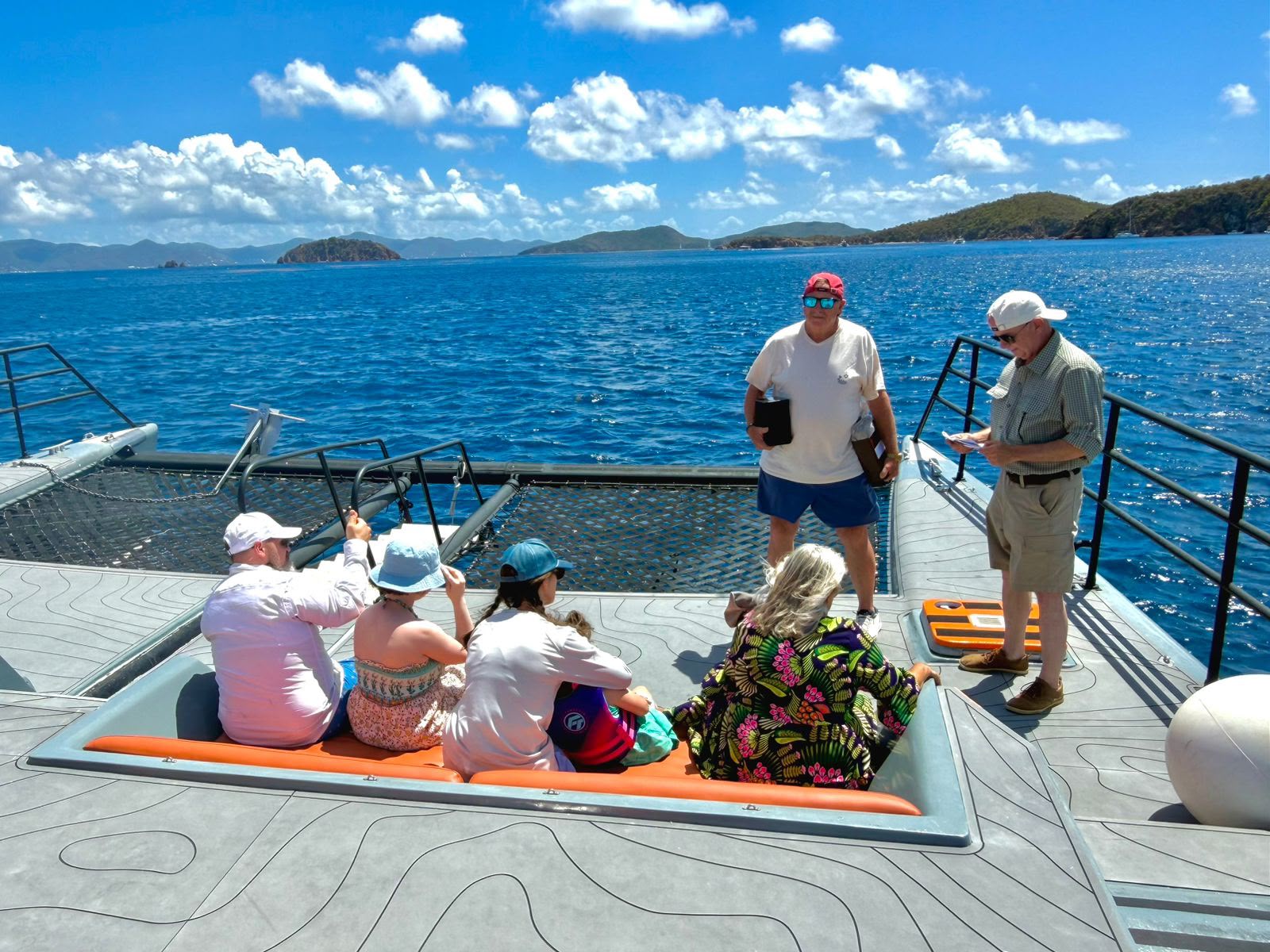 BVI villa guests on a day trip power catamaran Papi Chulo
